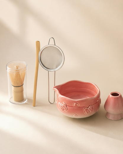 Blush Bow Sakura Pink matcha set: bowl, whisk, whisk holder, scoop, and sifter flat lay