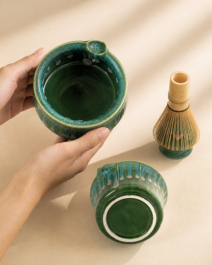 Holding the Matcha Spring bowl, whisk and whisk holder in the background