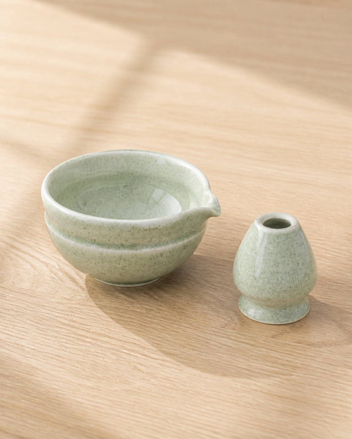 Bamboo Whisper matcha bowl and whisk holder on a wooden table