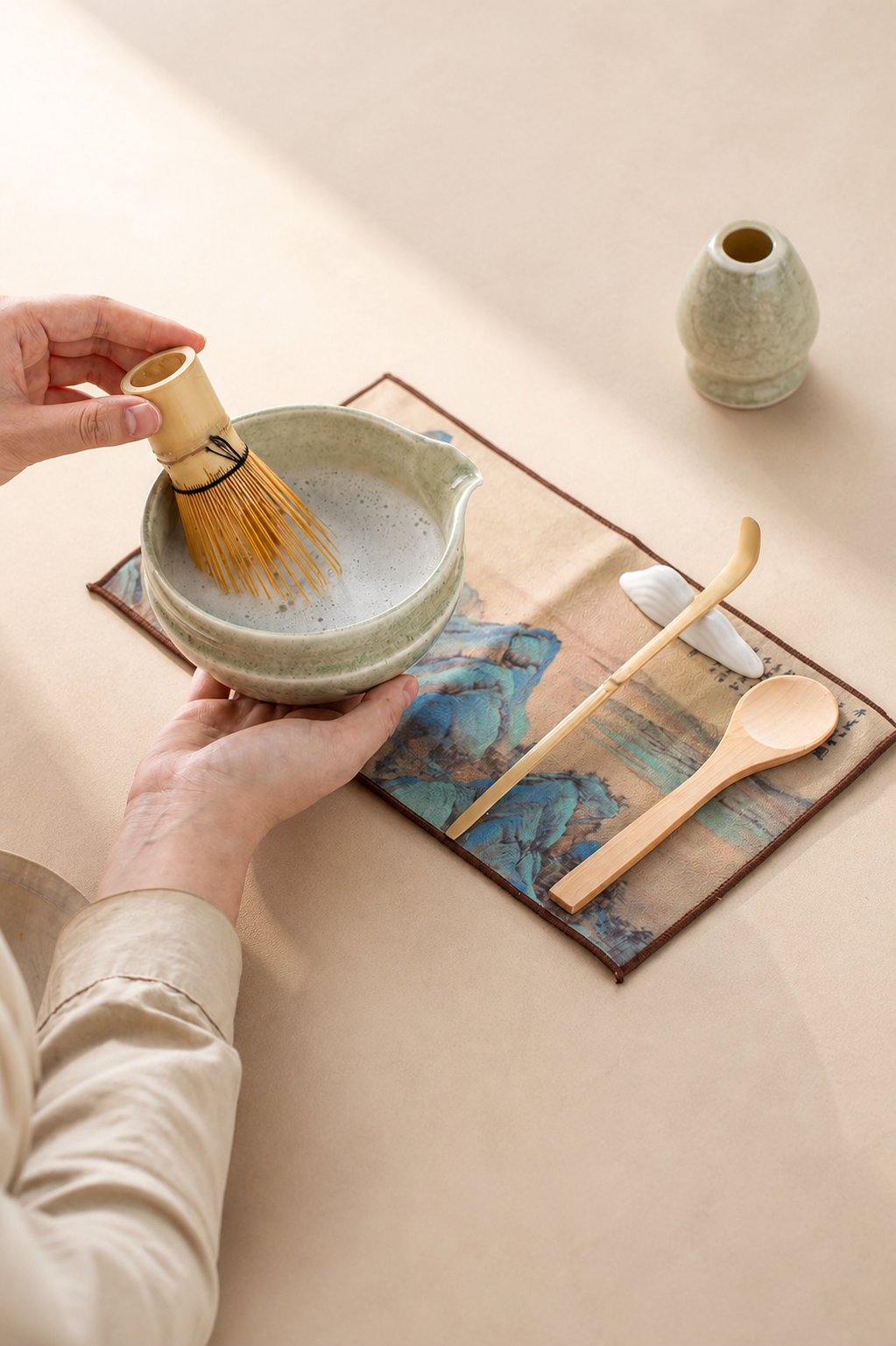 Holding the Bamboo Whisper bowl with whisk holder, spoon, and scoop nearby