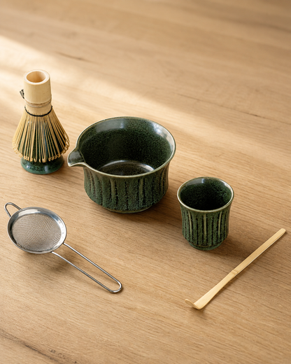 Matcha Spring Dark Green set: bowl, whisk, tasting cup, scoop, and sifter on a wooden table
