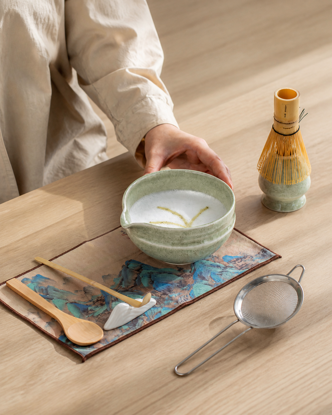 Bamboo Whisper bowl on the tea mat with whisk holder, sifter, scoop, and spoon