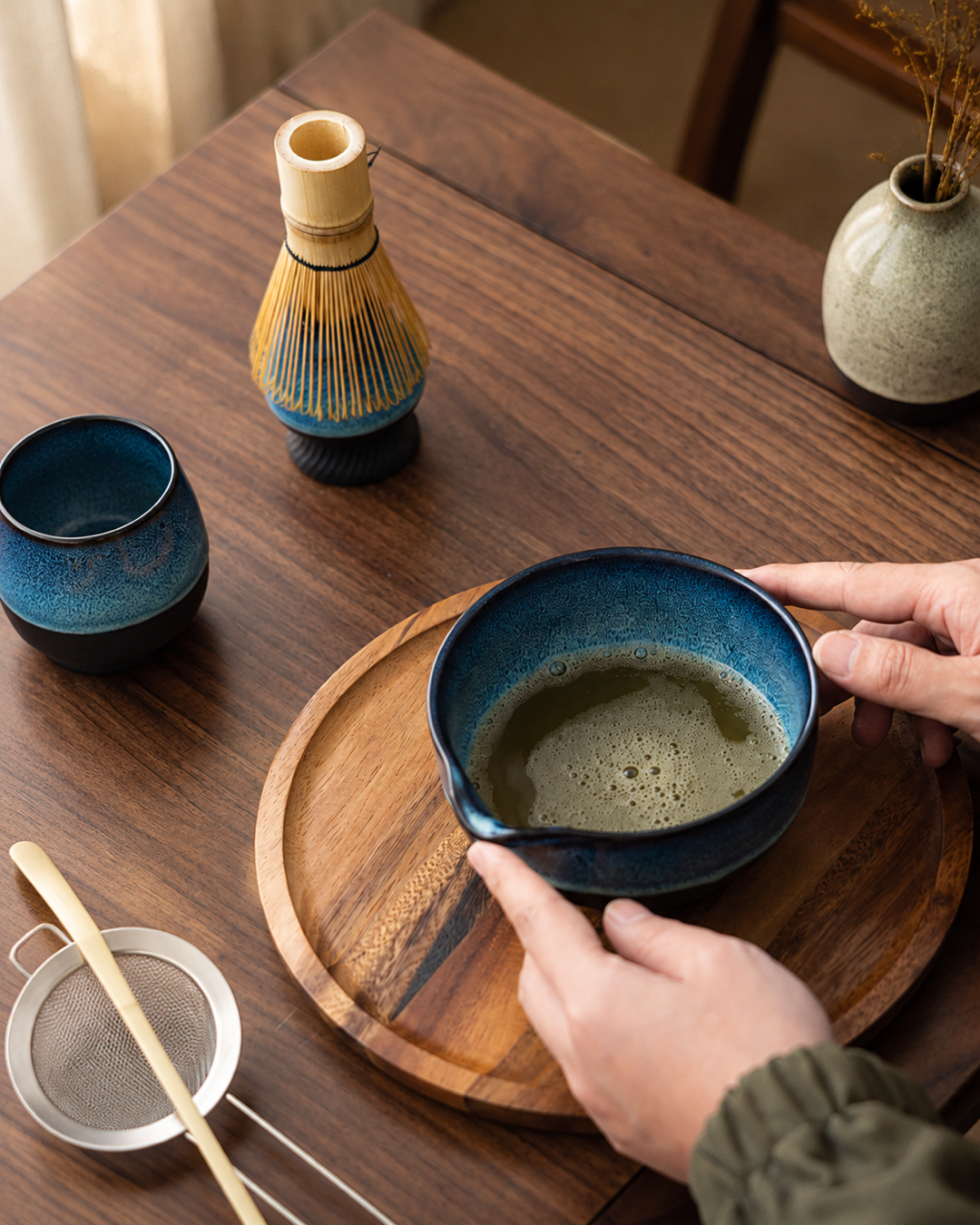 Kiln & Ritual matcha bowl with whisk holder in warm morning light