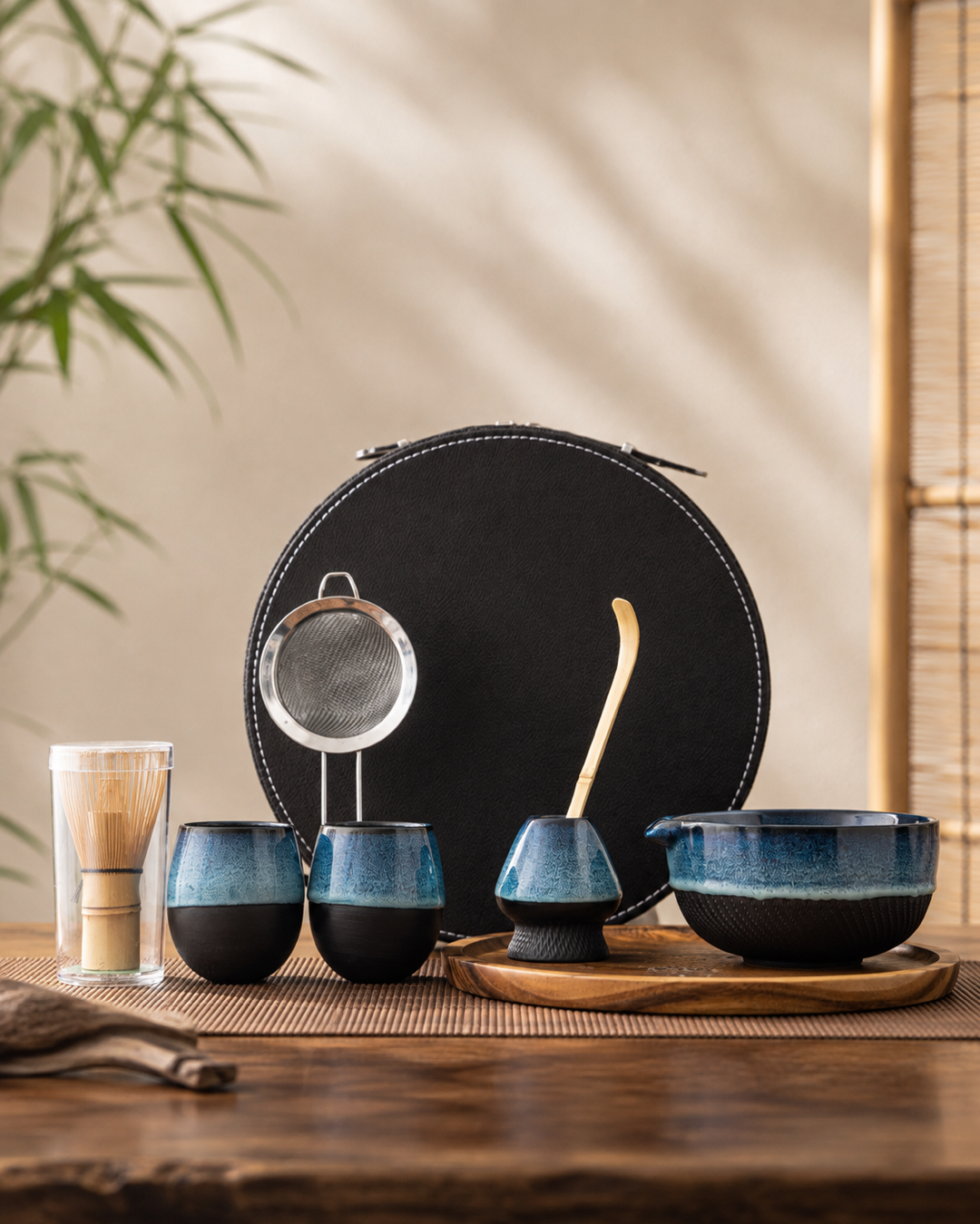 Kiln & Ritual blue ceramic matcha bowl with bamboo whisk and scoop