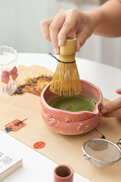 Pink and green matcha ceremony set with whisk, holder, sifter, and tray