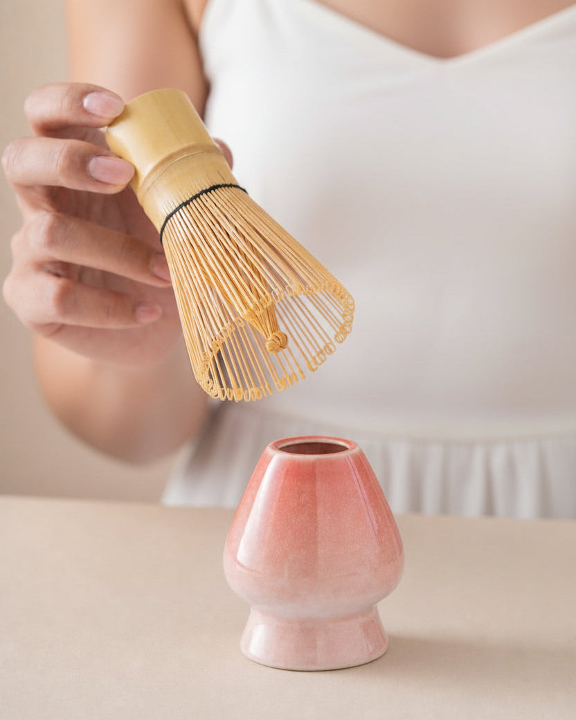 Bamboo Ritual bamboo whisk resting on ceramic whisk holder